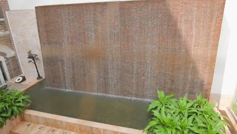 water-falling-down-from-wall-wide-view