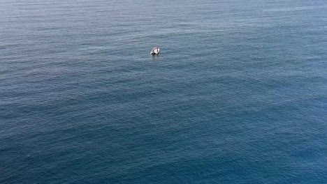 Drone-shot-towards-a-small-boat-in-the-Mediterranean-sea