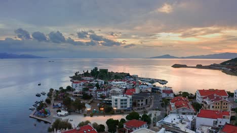 View-from-drone-at-seaside-town-centre-against-romantic-sunrise-cloudscape,-Turkey