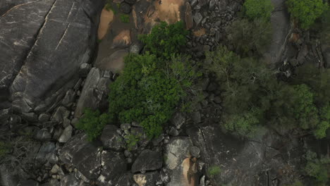 Granite-Gorge-aerial-views-with-rocks-and-trees-in-Queensland,-Australia