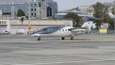Incredibly-aerodynamic-Piaggio-avanti-turboprop-corporate-airplane-taxiing-to-gate-after-landing-in-European-Airport