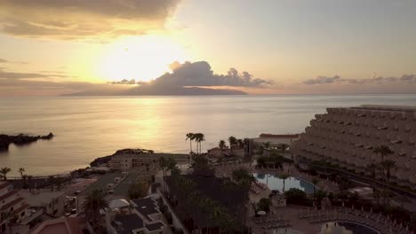 ocean-sunset-view-of-la-gomera-island-from-Tenerife-scenic-coastline-aerial-footage-of-spain-top-travel-holiday-destination
