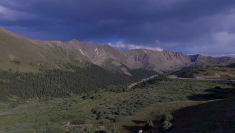 Cars-driving-over-winding-rocky-mountain-pass-drone-4k