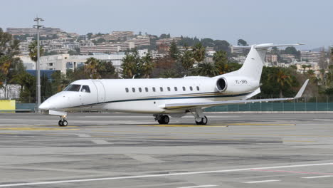 Legacy-600-private-jet-arriving-and-taxiing-to-gate-after-landing-in-Nice-airport,-France