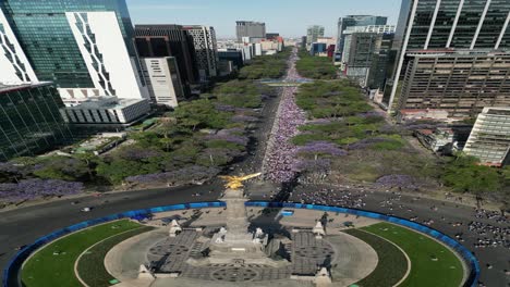 Aerial-vertical-view-March-8th-Women's-Day-march,-on-Paseo-de-la-Reforma,-8-march-2023-,Mexico-City