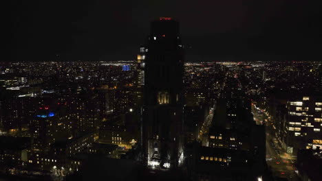 Aerial-view-around-the-Riverside-church,-night-in-New-York,-USA---orbit,-drone-shot