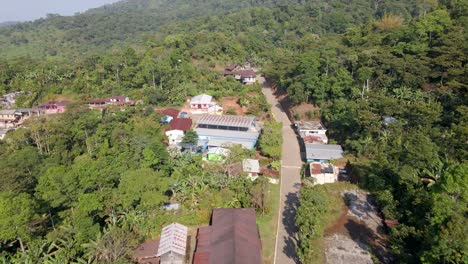 Aerial-shot-of-the-road-to-the-La-Conquista-village-public-school-in-San-Marcos,-Guatemala