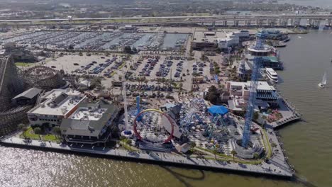 Aerial-overview-around-the-Kemah-Boardwalk-amusement-park,-in-sunny-Texas,-USA