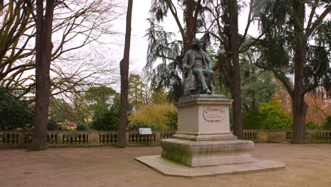 Statue-Of-Michel-Eugène-Chevreul-At-Jardin-des-plantes-d'Angers-In-Angers,-France---wide-shot