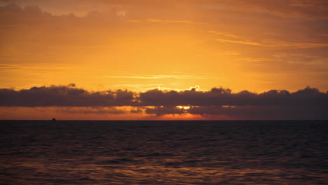 Sea-Sunset---Sun-Disk-Slowly-Moves-Down-Appearing-From-Behind-Clouds-and-Hides-Behind-Ocean-Horizon---Time-Lapse