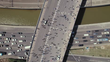 Israelis-walk-on-a-road-and-block-a-central-bridge-in-Tel-Aviv-as-a-demonstration-against-the-government