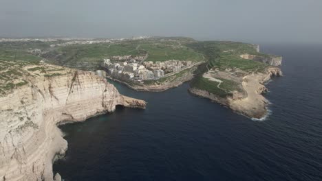 Drone-View-Over-Xlendi-Bay-And-Xlendi-Tower,-Gozo-Island,-Malta