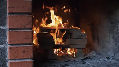 Firewood-burning-in-the-fireplace-in-slow-motion