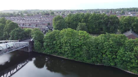 Aerial-view-Manchester-ship-canal-swing-bridge-trees-Warrington-England-revealing-countryside-houses
