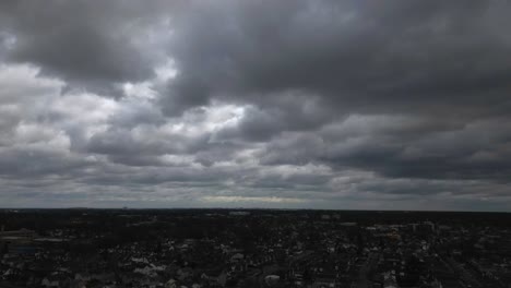 An-aerial-time-lapse-over-a-Long-Island-residential-neighborhood-during-a-cloudy-evening
