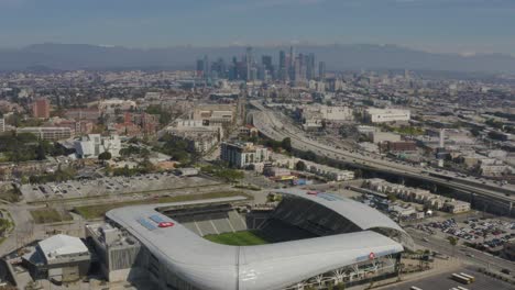 Amazing-Aerial-BMO-Soccer-Stadium-in-Los-Angeles-with-Snowy-Mountains