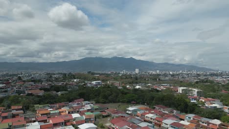 Drone-Shot-of-Beautiful-Sunny-Skies-over-San-Jose-Costa-Rica-with-Mountains-in-Background
