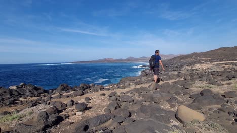 Hiking-at-the-coast-of-Lanzarote-sea-rocks-waves-sun