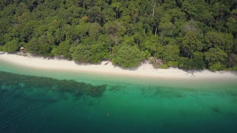 Aerial-view-of-incredible-beach-and-clear-waters-in-Thailand---camera-tracking-and-panning