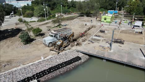 Drone-shot-view-of-city-park-construction-process-in-Mexico,-4k-Video-Excavators