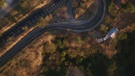 Flying-Above-National-Roads-And-Roundabout-At-Sunset-Near-Tuxpan-In-Jalisco,-Mexico