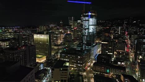 Portland-Oregon-Aerial-v113-flyover-downtown-from-Pearl-District-capturing-urban-downtown-cityscape-with-shimmering-exterior-of-high-rise-buildings-at-night---Shot-with-Mavic-3-Cine---August-2022
