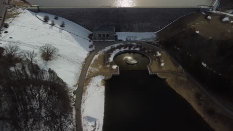 Wide-drone-shot-over-looking-the-Wachusett-Reservoir-Dam-and-fountain