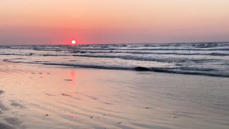 Beautiful-sunset-shallow-water-in-the-sea-Parisa-Bajelan-photographer-of-the-orange-red-scenic-sunset-in-the-Atlantic-ocean-relax-alone-luxury-wedding-warm-colorful-scenery-outdoor-activity-travel