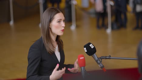 Finish-Prime-Minister-Sanna-Marin-giving-an-interview-during-the-European-Council-summit-in-Brussels,-Belgium---Slow-motion-shot