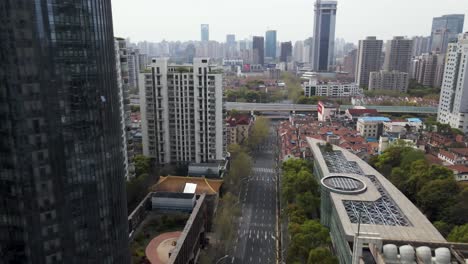 Empty-Streets-during-Covid-19-pandemic-Lockdown-in-Shanghai,-China---Aerial-Drone-Flight-of-City-Skyline