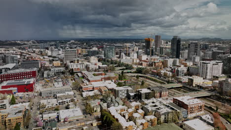 Portland-Oregon-Aerial-v98-flyover-Goose-Hollow-Foothills-League-neighborhood-towards-downtown-capturing-cityscape-with-ominous-storm-clouds-covering-the-sky---Shot-with-Mavic-3-Cine---August-2022