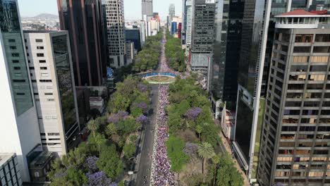 Drone-showing-the-international-march-for-women's-day-in-the-streets-of-the-Mexico-City,-8-march-2023