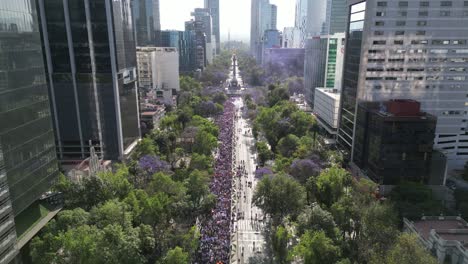 Drone-showing-the-international-march-for-women's-day-in-the-streets-of-the-Mexico-City,-8-march-2023,-aerial-view