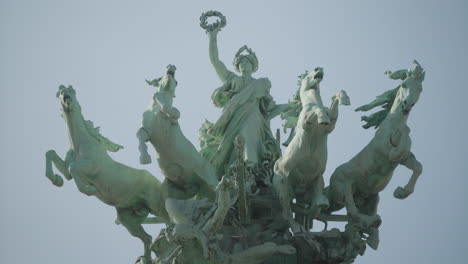 Close-up-of-sculpture-on-the-great-palace-in-Paris-meaning-Immortality-ahead-of-time
