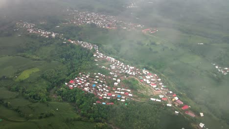 Aerial-shot-of-cultural-remote-Village-Rumah-Adat-Kampung-Uma-Leme-deep-into-the-Mountains-of-Central-Sumbawah,-Indonesia