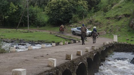 Truck-waits-for-local-Basotho-residents-to-cross-small-river-bridge