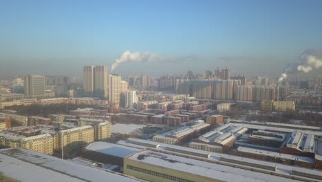 Crisp-winter-morning-aerial-flight-in-snowy-cold-city,-Harbin-China