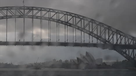 Regentropfen-Prasseln-Auf-Die-Windschutzscheibe-Eines-Autos,-Im-Hintergrund-Ist-Das-Opernhaus-Von-Sydney-Unscharf