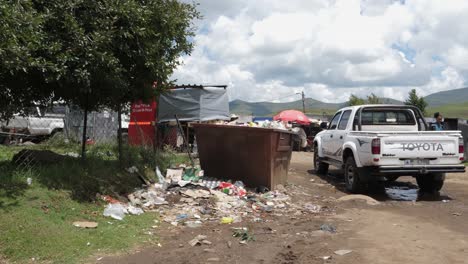 Garbage-dumpster-overflows-in-Lesotho-village-of-Semonkong,-Africa