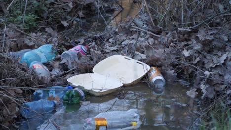 Plastic-packaging-thrown-into-the-river-in-the-forest