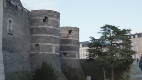 Group-Of-Tourists-Walking-By-The-Chateau-d'-Angers-In-The-City-Of-Angers-In-Loire-Valley,-France