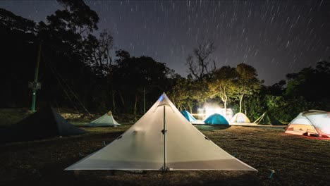 Night-lapse-of-starry-sky-over-busy-campsite,-Cheung-Sheung-Sai-Kung-Hong-Kong