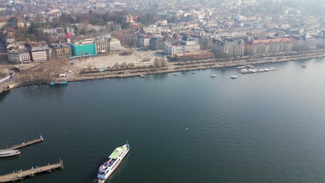 Aerial-of-Lake-Zurich-with-ferry-boat-and-coastline-town-square
