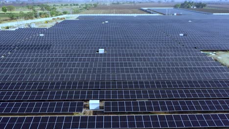 Arrangement-of-solar-energy-production-plant,-4k,-aerial-video,-aerial-view-when-moving-sideways,-pov-aerial-of-rotation-shoot