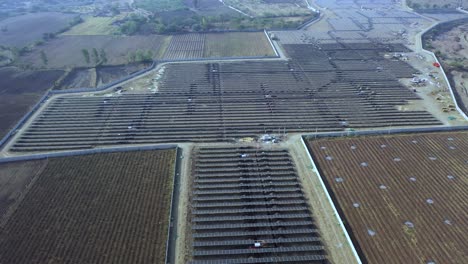 Solar-plant-with-the-summer-season,-hot-climate-causes-increased-power-production,-Alternative-energy-to-conserve-the-world's-energy,-aerial-view-when-moving-forward