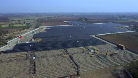Aerial-view-of-a-large-sustainable-electrical-power-plant-with-rows-of-solar-photovoltaic-panels-for-producing-clean-electric-energy