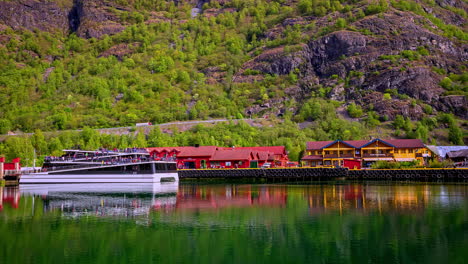 People-boarding-modern-ferry-that-leaves-in-Norway,-fusion-time-lapse