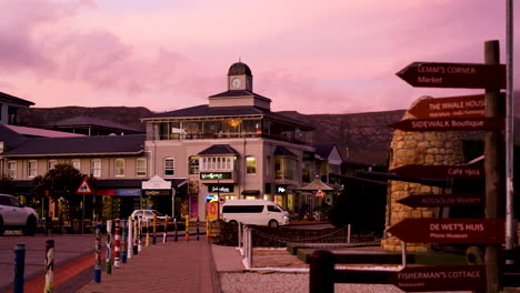 Hermanus-clock-tower-agains-pink-sky-at-sunset-along-waterfront,-South-Africa