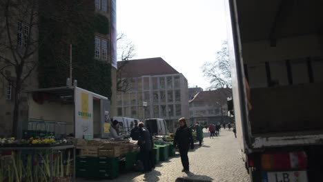 Loading-Truck-Near-Street-Vendors-Farmer's-Market---Schlossplatz-In-Downtown-Stuttgart-in-4K,-Classic-Germany-Architecture,-Famous,-Red-Komodo-Cooke-Mini-S4i-Lens-Premium-Quality-|-News