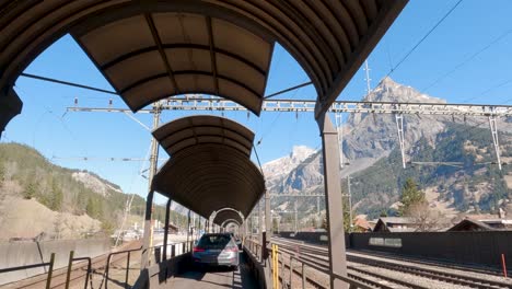 Vehicle-Exiting-Lotschberg-Car-Train-in-Kandersteg,-Switzerland